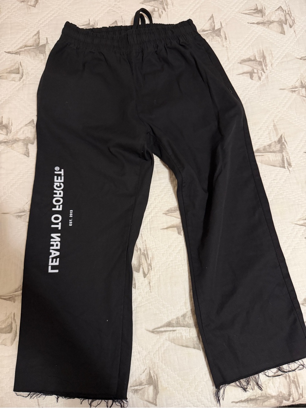 Learn to Forget Black Graphic Wide-Leg crop pants  with Logo